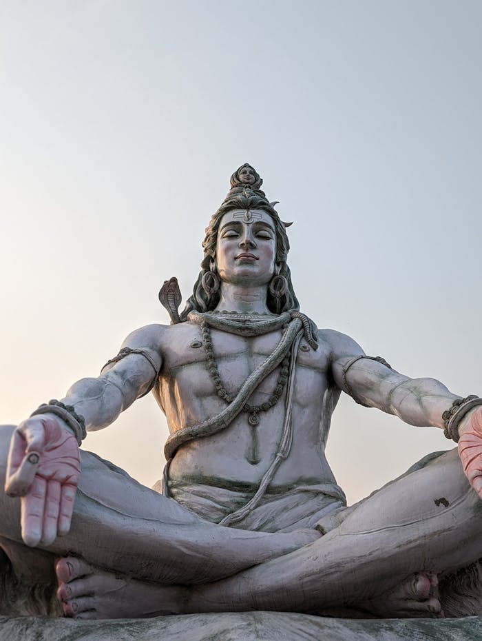 gallery-2 A magnificent statue of Lord Shiva captured under a serene sky evoking calmness.